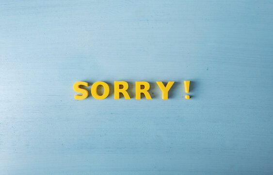 Sorry and apology message concept with yellow 3D letters and copy space
