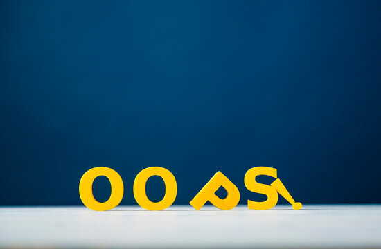 Oops mistake, error and unexpected problem concept with fallen yellow letters