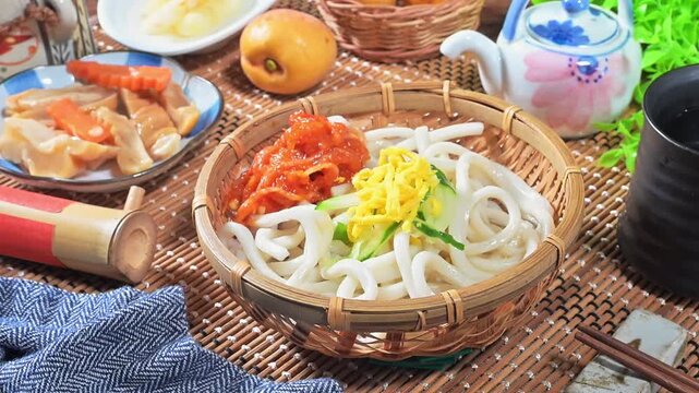 Korean kimichi cold udon noodles in bamboo basket