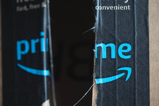 Amazon prime package damaged box, copy space bokeh background image, shipping issues theme	