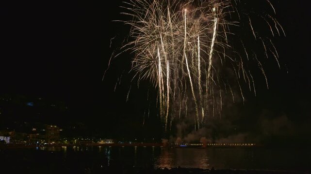Spectacular night fireworks display over the sea in javea, spain