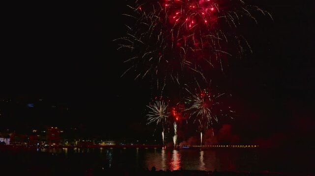 Spectacular night fireworks display over the sea in javea, spain