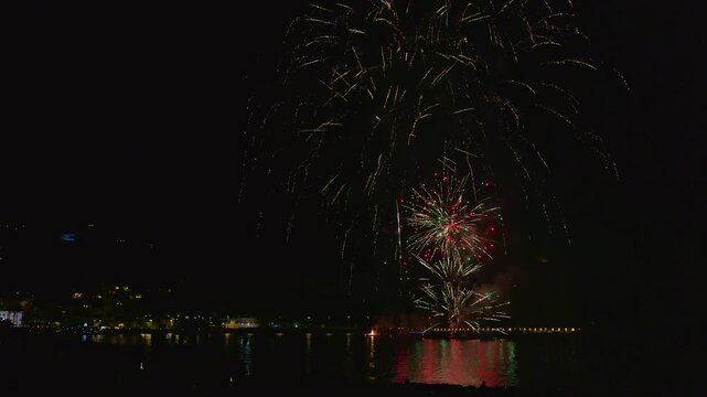 Spectacular night fireworks display over the sea in javea, spain