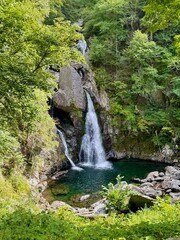 Bash Bish Falls, scenic waterfalls in the Berkshires, cascades through a rocky gorge along the New York–Massachusetts border. Connects with Taconic State Parks. Stunning hiking trails. © theplantedwanderer