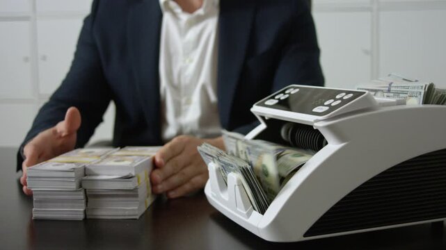 Hand counting dollars close up. Business finance management in office. Banker counting cash closeup. Financial planning. Financial management. Money counting and accounting in finance office.