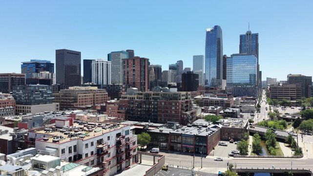 Flying towards the center of Downtown Denver in Colorado on a clear sunny summer day. 
