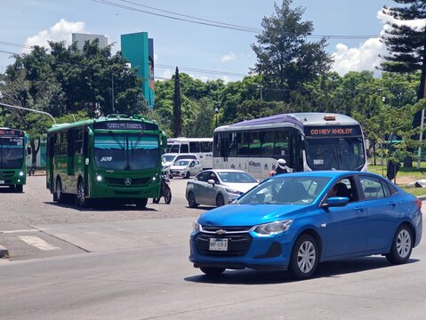 ZAPOPAN, MEXICO - AUGUST 5, 2026: Blue Chevrolet Onix sedan driving through city traffic.