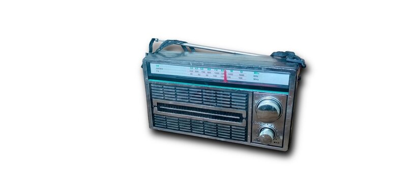 Vintage retro AM FM radio receiver with antenna isolated on white background
