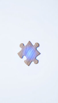 Wooden puzzle piece on white background supports data driven decision making through playful problem solving and thoughtful strategy