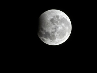 Obraz premium A close-up shot capturing the stunning partial lunar eclipse during the night of August 27 to 28, 2026, as seen from the southern hemisphere in Brazil. 