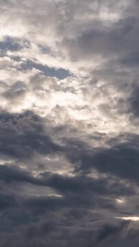 Dramatic time lapse of dark storm clouds rolling in, concept of bad weather and heavy rain.