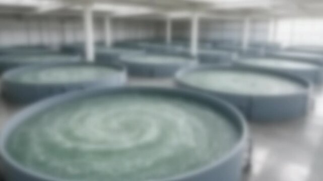 Rows of circular tanks in a bright land-based fish farm, Full Gaussian Blur Abstract