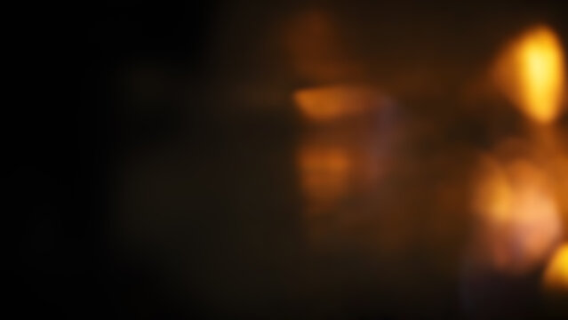 Abstract gold light leaks and bokeh on black background for overlay and video transitions