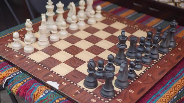 Enjoying a chess game on a colorful table