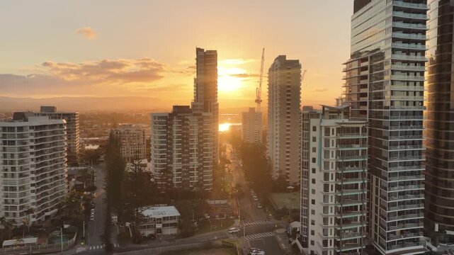 Sunset aerial drone footage above the Gold Coast city towers at Surfers Paradise, Queensland Australia