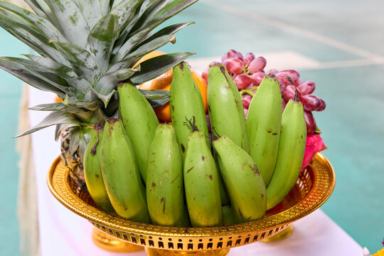 Large woven basket overflowing with various fresh fruits