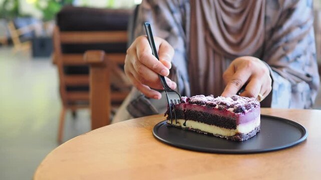 Enjoying a slice of cake at a local cafe