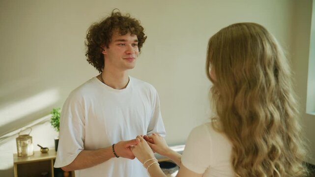 Couple enjoys a moment together in a bright room during a casual afternoon activity at home