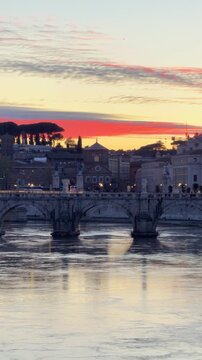 St Peter's Basilica at Sunset in Rome Italy. Slow Pan Right. Tiber River with Row Boat Silhouette. Shot on Mobile - Vertical Video.