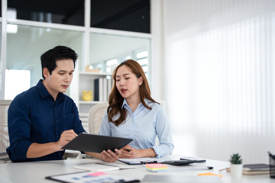 Asian Businesspeople working with papers for planning, financial analysis and chart.  discussion in boardroom for investment, risk management or budget report.