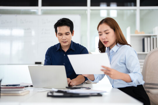 Business partners working with analysis report and advisor showing plan, Two businessman working with Financial analysts reports and planning investment at office.