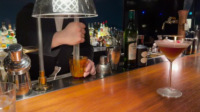 Bartender Muddling Ingredients for a Cocktail at a Bar in Kanazawa
