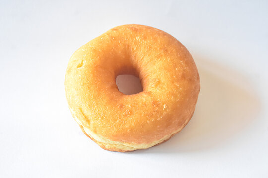 Golden fried plain ring donut isolated on white background