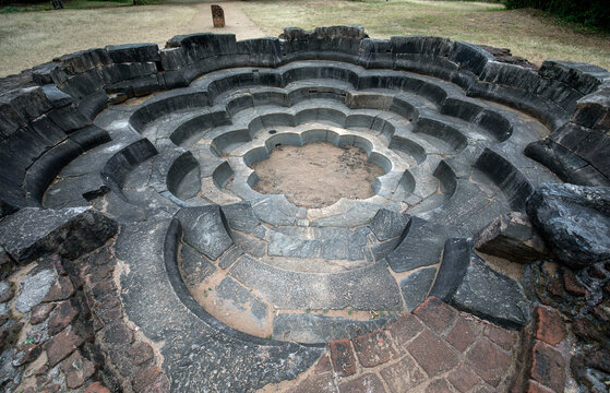 The stone carved Lotus Pond at the ancient site of Polonnaruwa in Sri Lanka. Designed to resemble a fully blown lotus flower it sits adjacent to the Jetavanarama built by King Parakramabahu the Great.