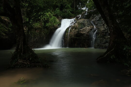 Beautiful Chet Khot waterfall with soft flowing water in the tropical rainforest, Kaeng Khoi, Saraburi, Thailand. 