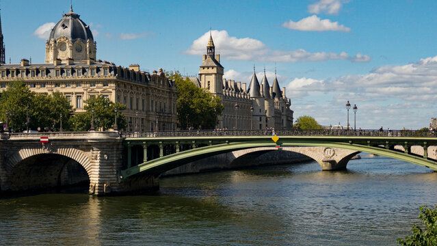 Historic Conciergerie and Palais de Justice buildings with Pont au Change over Seine River