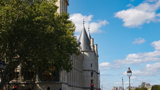 Historic towers and facade of the Conciergerie in Paris on a sunny day