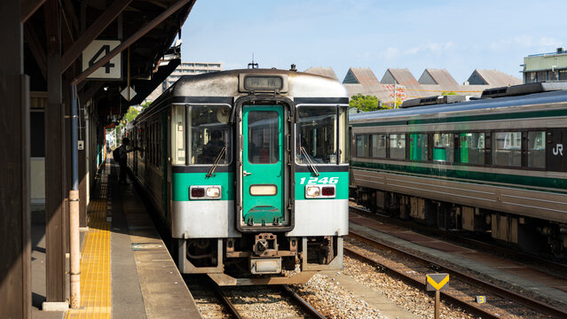 Tokushima, Japan - July 27 2026: JR Shikoku 1200 series diesel local train stopped at Tokushima Station platform