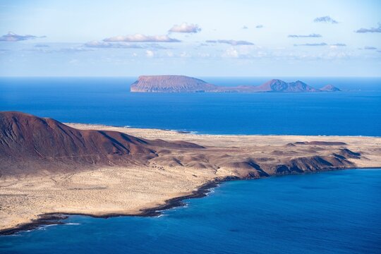 View of the sea and the island of La Graciosa, behind Isla de Alegranza, Lanzarote, Canary Islands, Spain