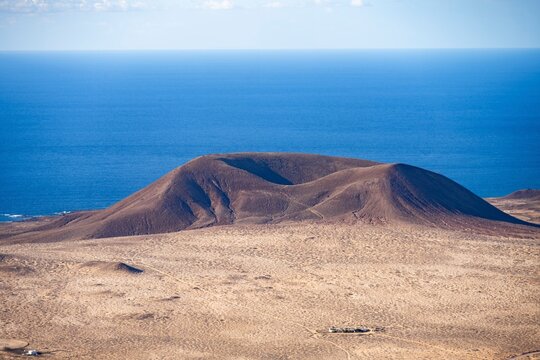 View of the sea and the island of La Graciosa with the volcanic crater Monta&ntilde;a del Mojon, Lanzarote, Canary Islands, Spain