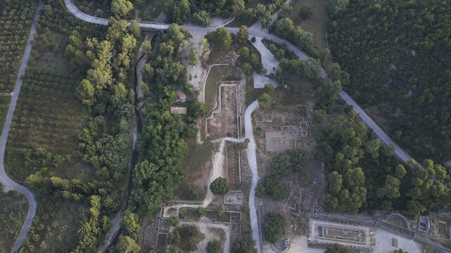 Olympic excavation site from high altitude, Temple of Zeus, Temple of Hera, Palestra Philippeion, etc. Historic ruins crisscrossed by roads and paths, surrounded by forest, aerial photo photographed, drone shot, archaeological excavation site, Ancient Olympia, Olympia, Peloponnese, Greece