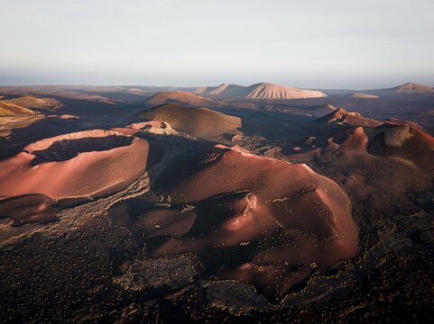 Sunrise volcanic crater, crater landscape, Timanfaya National Park, drone shot, Lanzarote, Spain