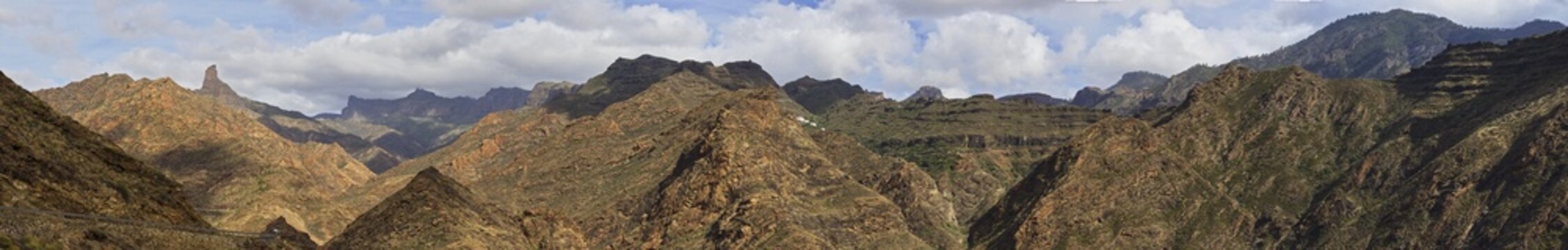 Panorama shot, Roque Bentayga, Massif Central, cloudy blue sky, Barranco de la Aldea, gorge, Gran Canaria, Canary Islands, Spain