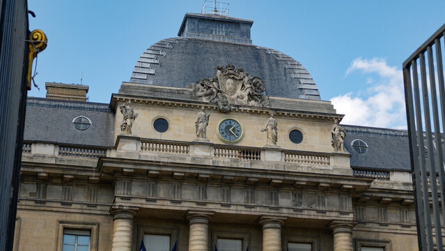 PARIS, FRANCE - SEPTEMBER 1, 2026 - Palais de Justice showcasing its classical architecture, rooftop, and decorative elements under blue sky