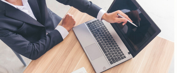 Banner Man working from home using laptop online meeting home office. Businessman hands typing...