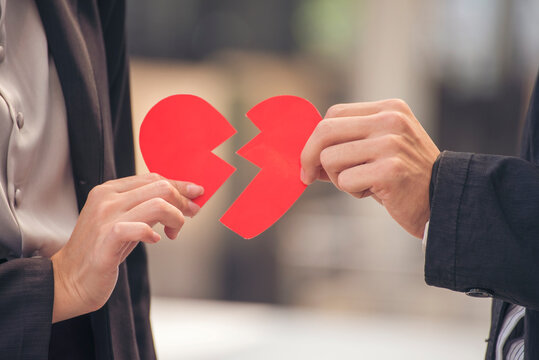 Two hand holding broken heart relationship couple breakup distress emotional. Divorce family separation grief despair. Arguing conflict loneliness broken heart relationship. Stress mental burnout