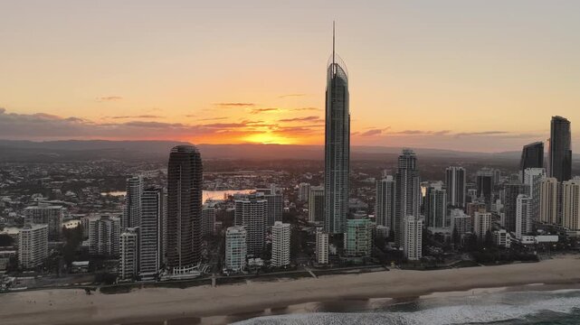 Aerial drone view of the Q1 skyscraper and Surfers Paradise skyline at golden hour, Gold Coast, Queensland Australia
