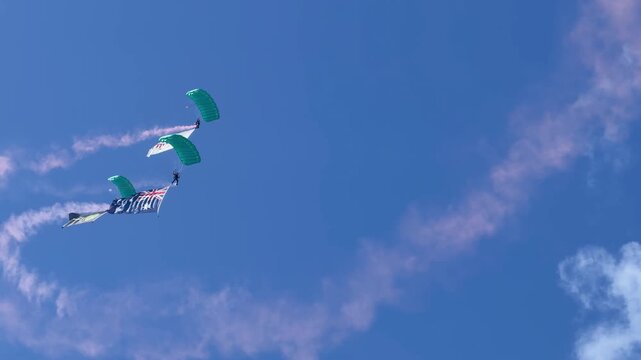 Skydivers with Australian Flag and Smoke Trails at Gold Coast Airshow