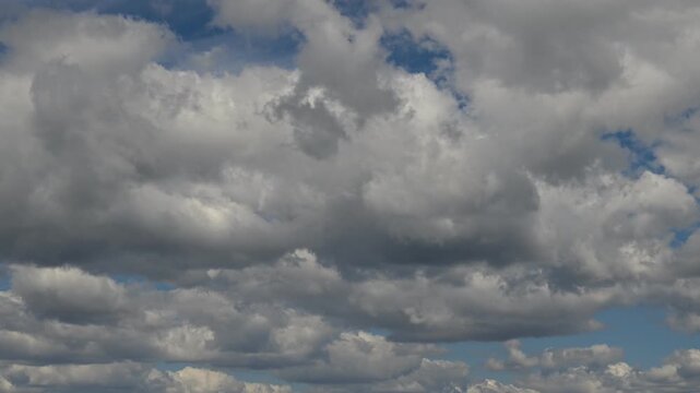 timelapse of thick grey stratocumulus clouds covering the whole sky completely