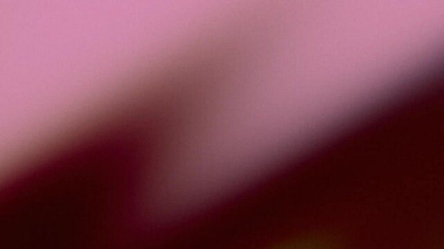 Grainy abstract background with diagonal pink and purple gradient