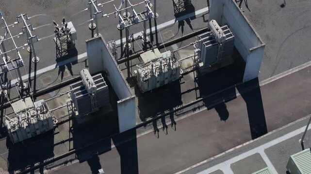 Aerial view of a power plant and high voltage electric substation with transformers
