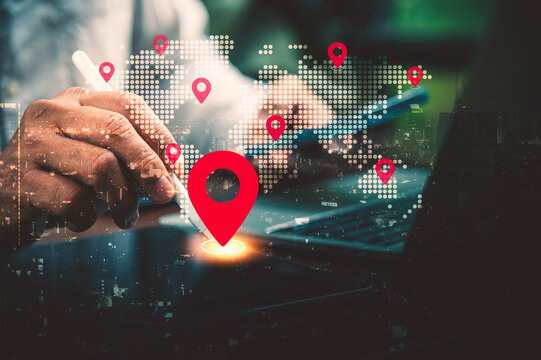 Global Logistics and Location Tracking Concept with Hand Holding Stylus over Digital World Map.
