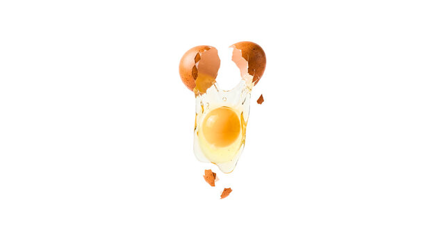 Creative fried egg composition with broken eggshells on a white background.