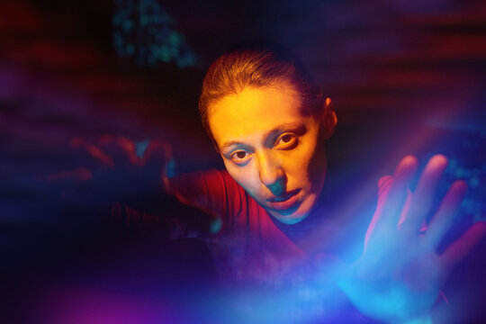 Woman explore virtual reality with holographic interface