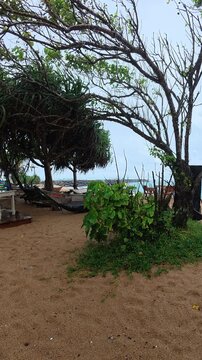 Moody and peaceful rainy day at an empty seaside lounge with coastal ocean view in Sri Lanka