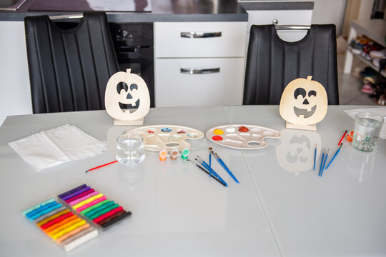 Halloween DIY decoration craft setup on kitchen table